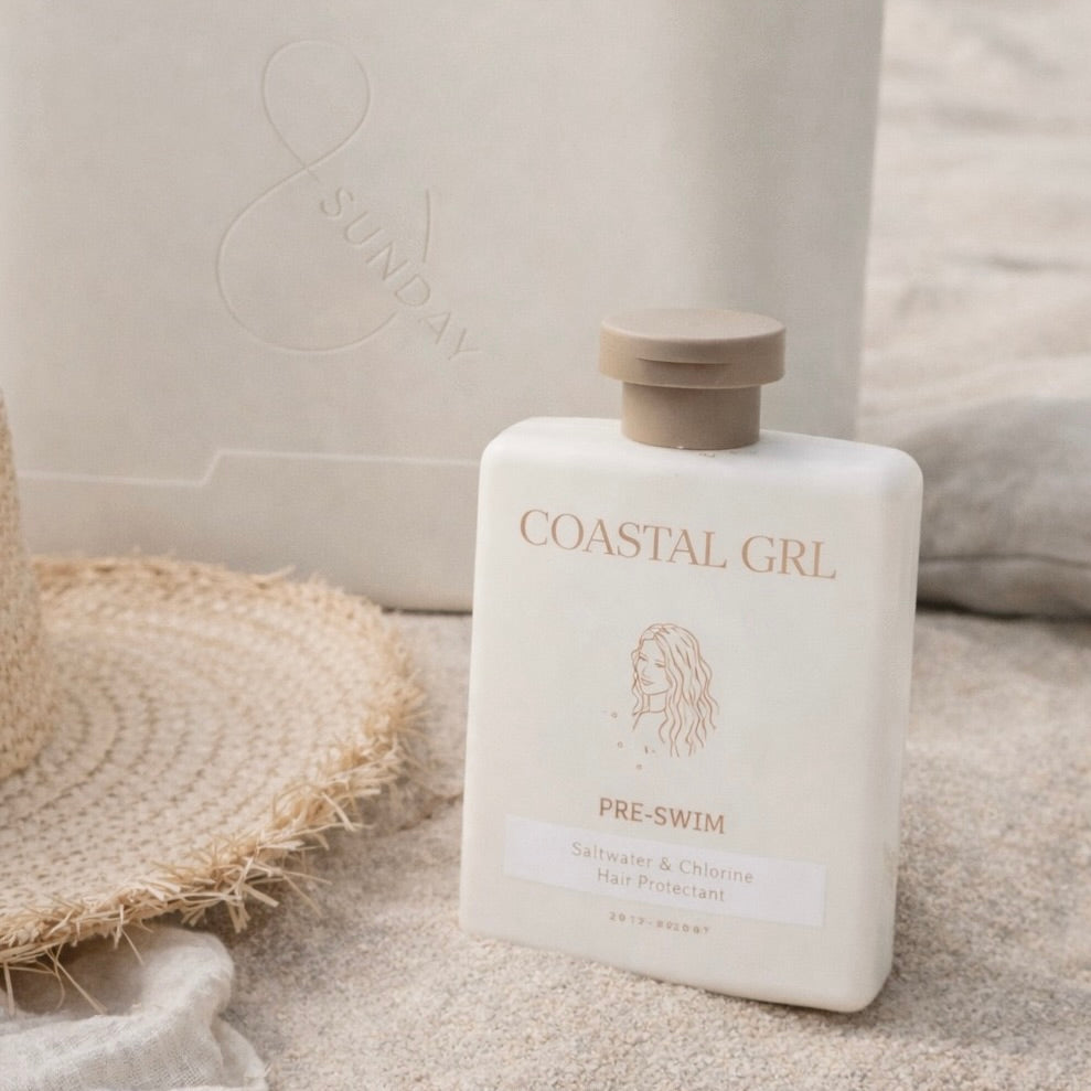 Coastal Girl pre-swim product bottle on a neutral background
