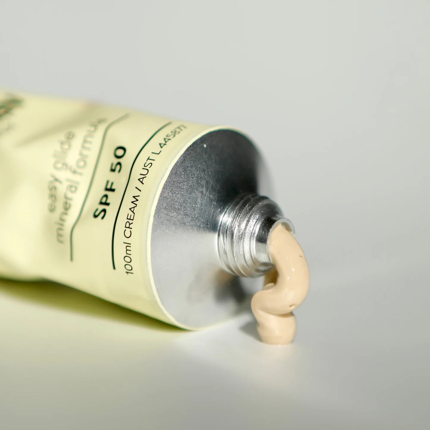 Tube of sunscreen cream with a clear background